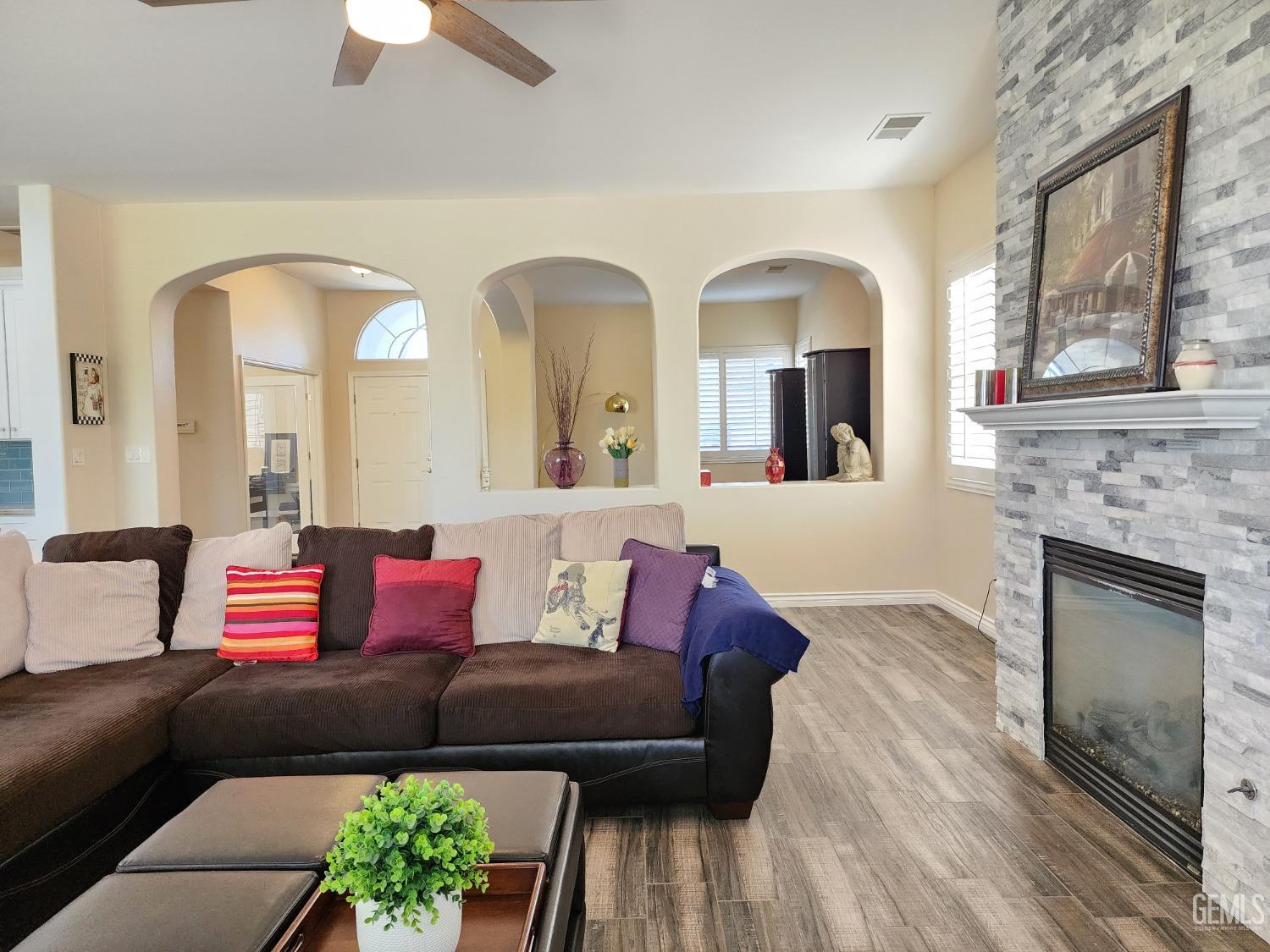 Undisclosed Address Bakersfield, CA 93312 - Photo 23 of 44 a living room with furniture and a fireplace