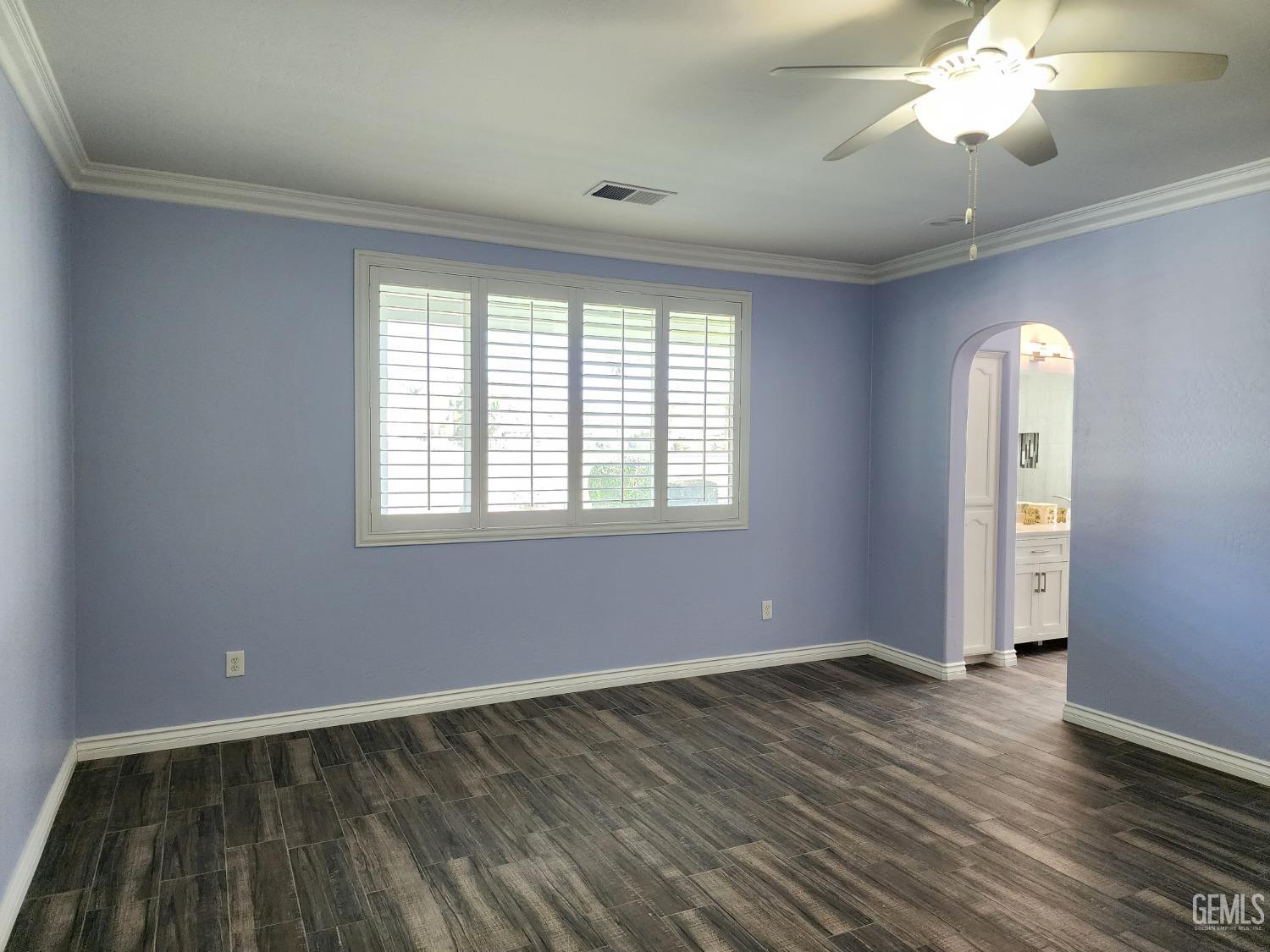 Undisclosed Address Bakersfield, CA 93312 - Photo 24 of 44 a view of an empty room with wooden floor and a window