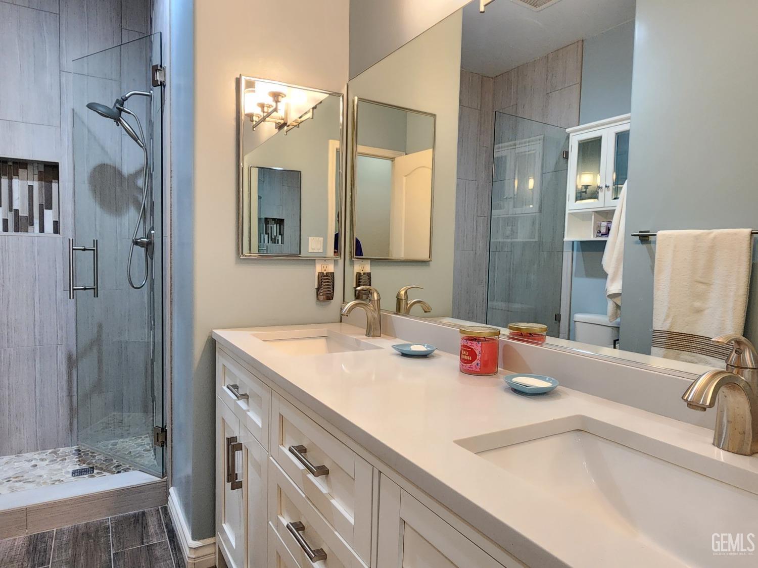 Undisclosed Address Bakersfield, CA 93312 - Photo 31 of 44 a bathroom with a sink and a mirror