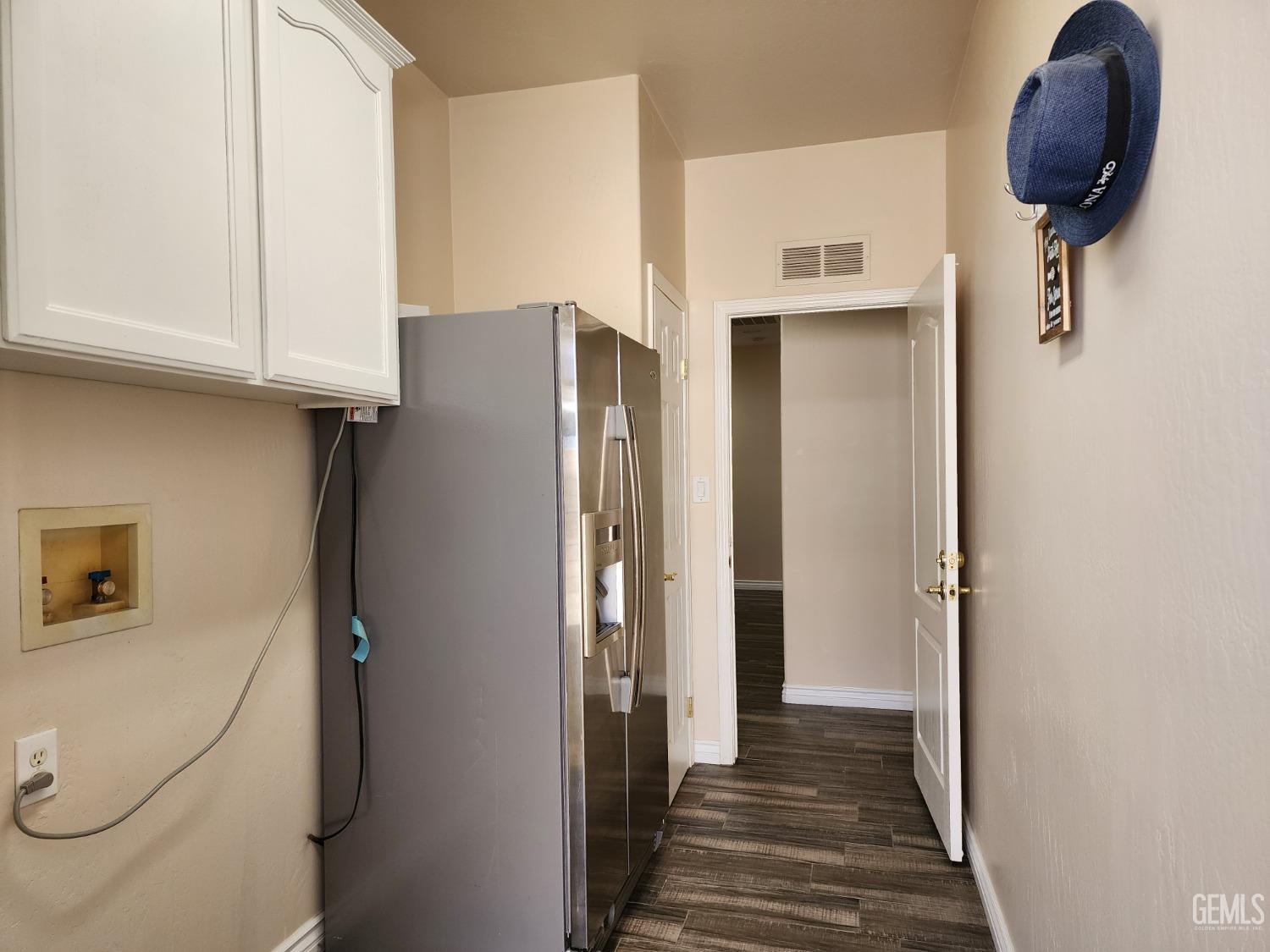 Undisclosed Address Bakersfield, CA 93312 - Photo 34 of 44 a view of a hallway with entryway wooden floor and staircase