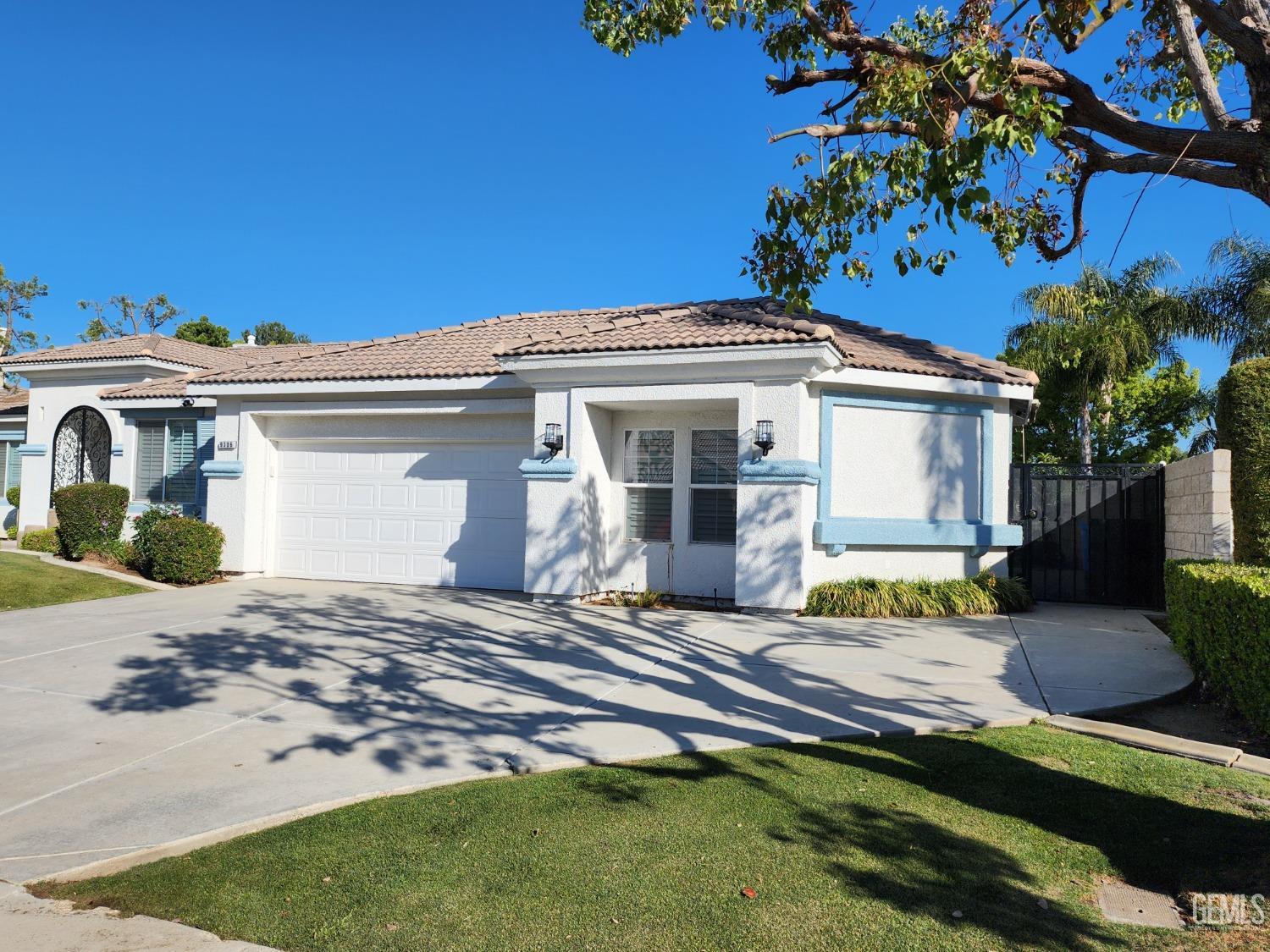 Undisclosed Address Bakersfield, CA 93312 - Photo 35 of 44 a front view of a house with garden