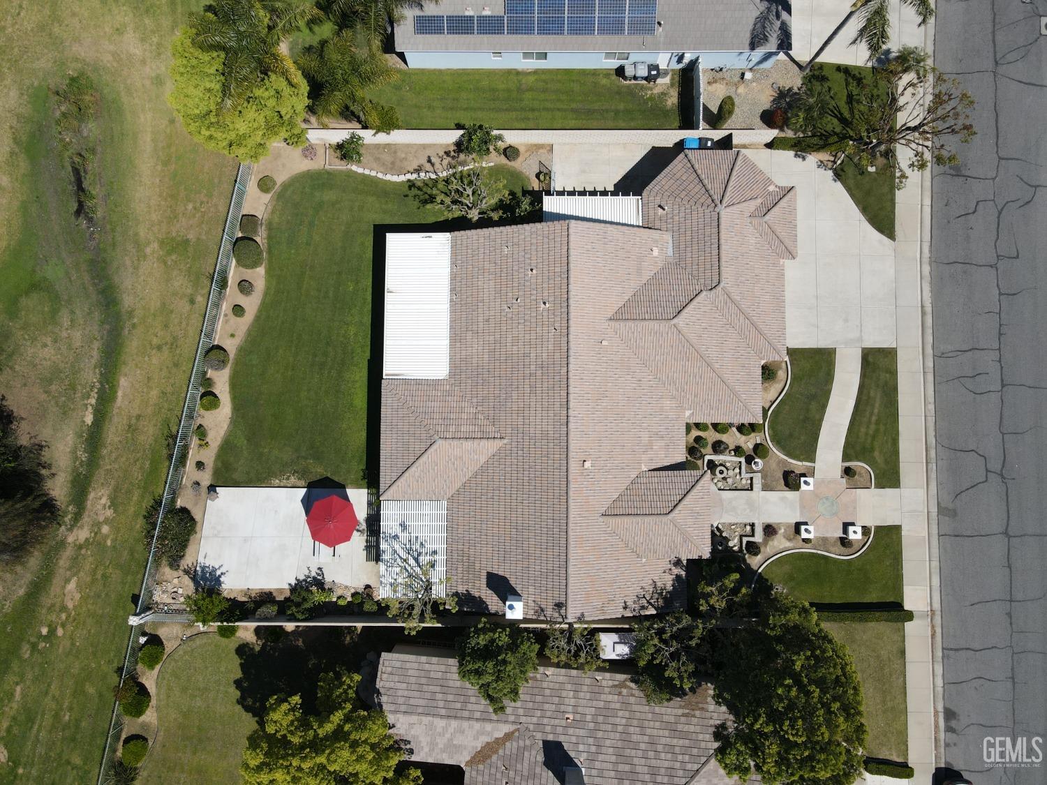 Undisclosed Address Bakersfield, CA 93312 - Photo 39 of 44 an aerial view of a house with a swimming pool