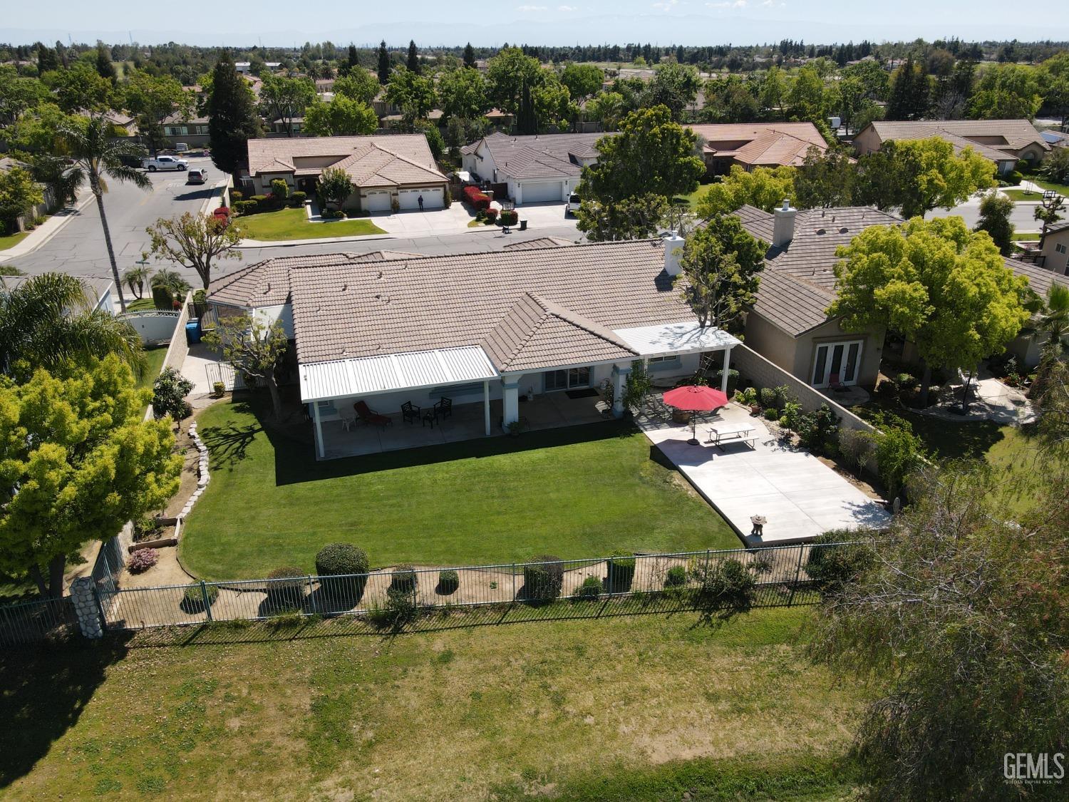Undisclosed Address Bakersfield, CA 93312 - Photo 40 of 44 an aerial view of a house with swimming pool and mountains
