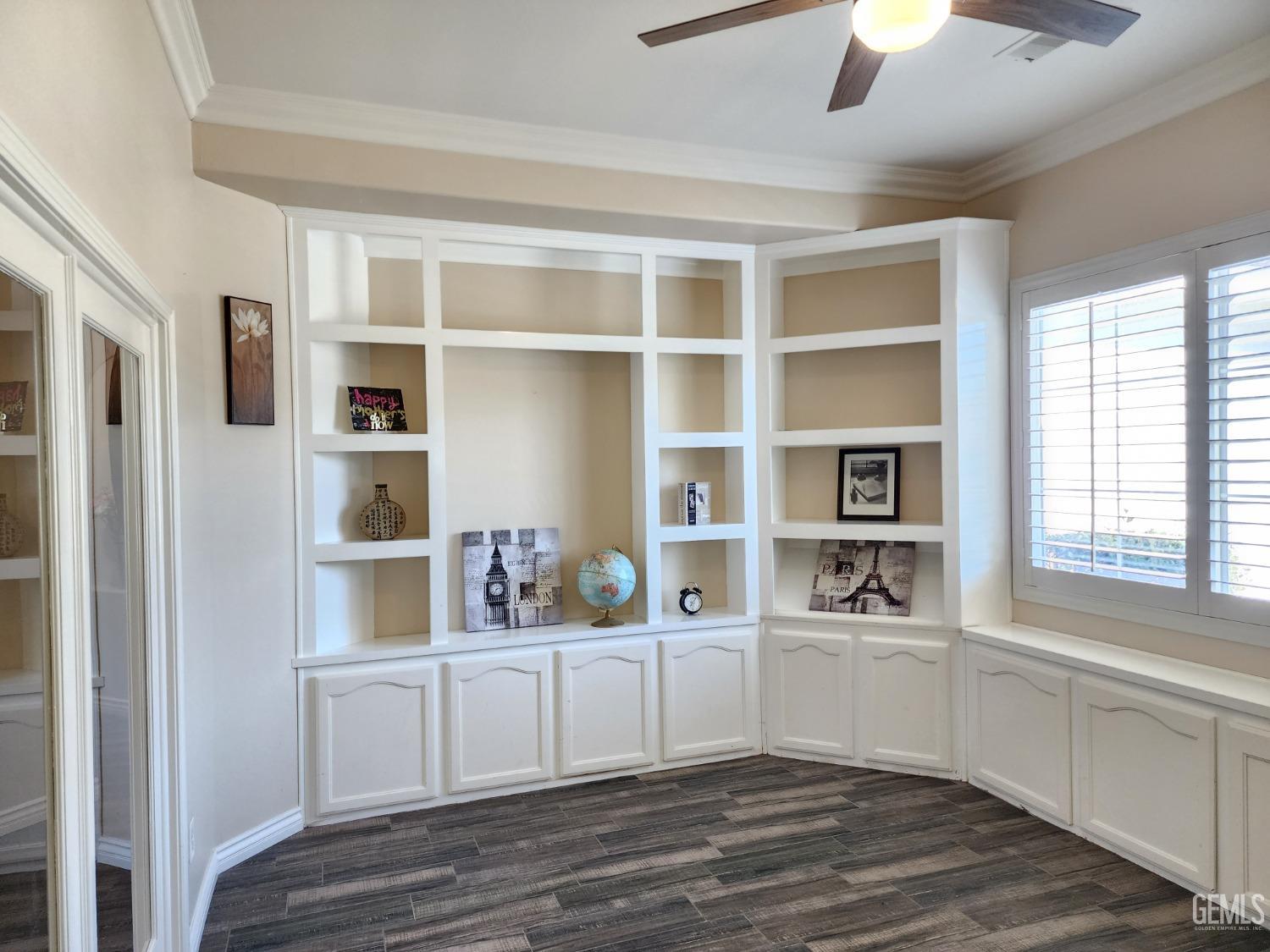 Undisclosed Address Bakersfield, CA 93312 - Photo 5 of 44 a view of cabinets with wooden floor and window