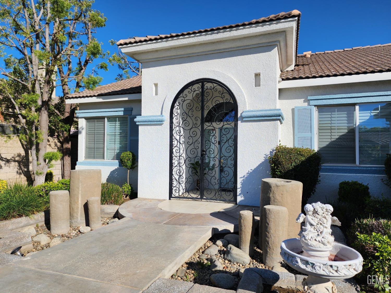 Undisclosed Address Bakersfield, CA 93312 - Photo 10 of 44 a front view of a house with a chairs