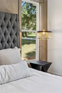 a bathroom with double vanity sink and a mirror