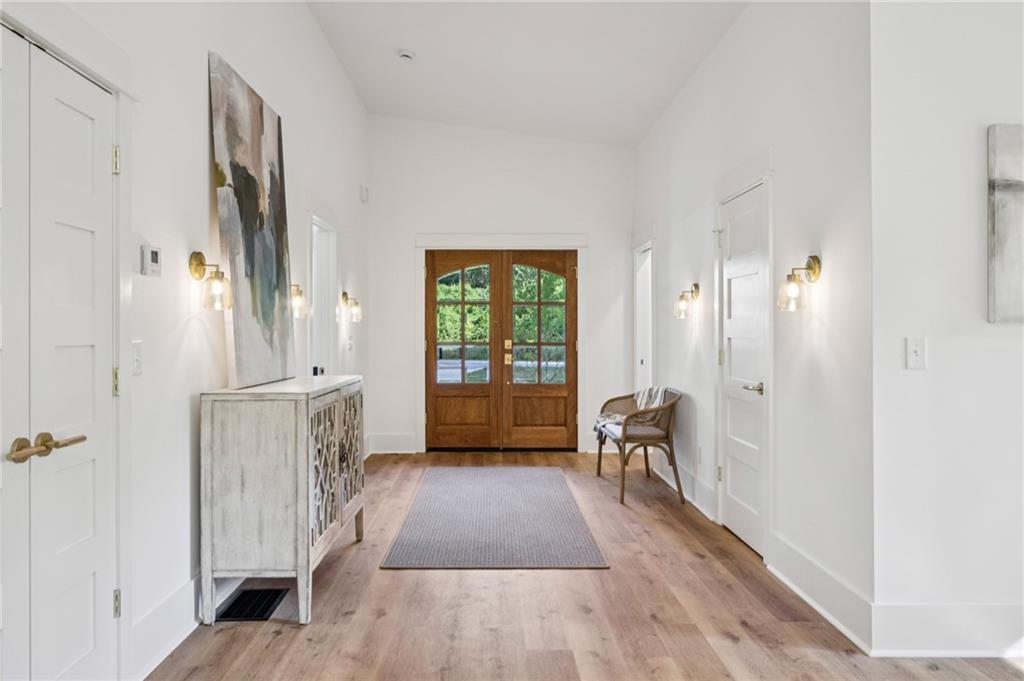 2387 Cranbrooke Drive Decatur, GA 30032 - Photo 2 of 44 a view of a hallway with wooden floor and a window