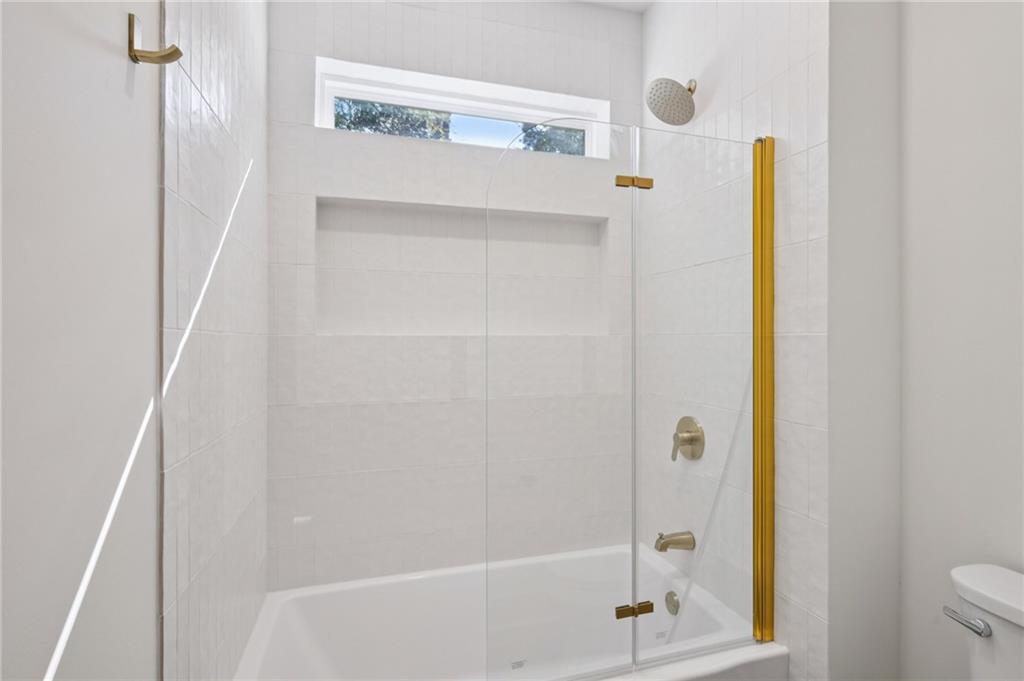 2387 Cranbrooke Drive Decatur, GA 30032 - Photo 23 of 44 a bathroom with a bathtub and a shower