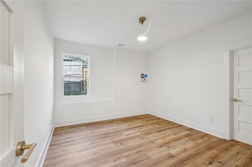 2387 Cranbrooke Drive Decatur, GA 30032 - Photo 25 of 44 an empty room with wooden floor and windows