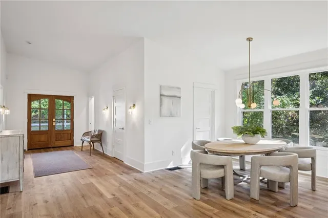 a view of a dining room with furniture window and outside view