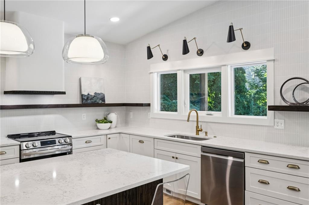 2387 Cranbrooke Drive Decatur, GA 30032 - Photo 7 of 44 a kitchen with a sink a stove and a window