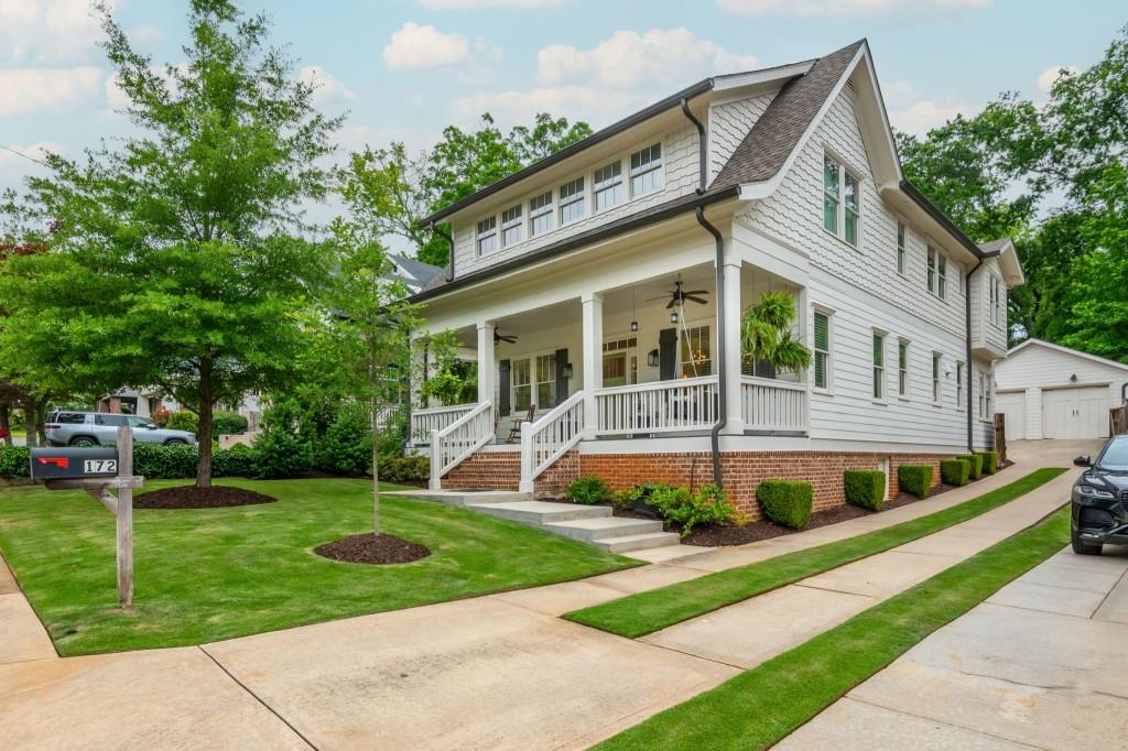 a front view of a house with a yard table and chairs