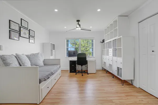 a bedroom with a bed and a couch