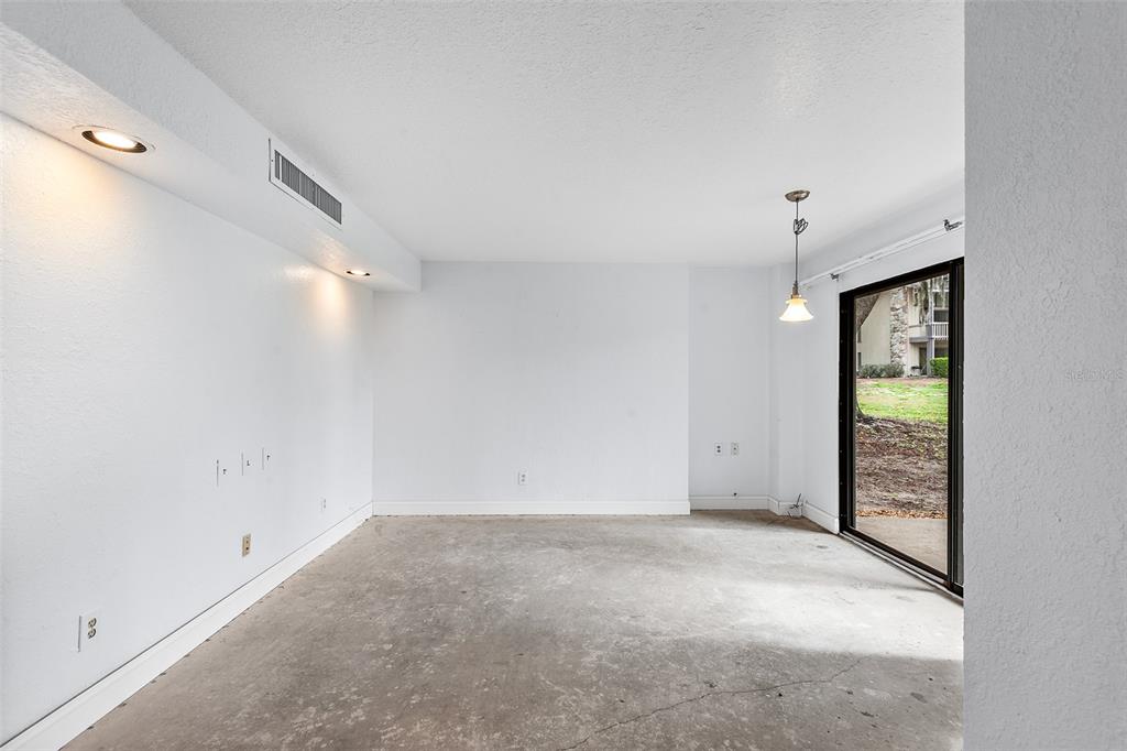 2070 Corner Lake, Unit AB Haines City, FL 33844 - Photo 17 of 31 an empty room with windows and closet