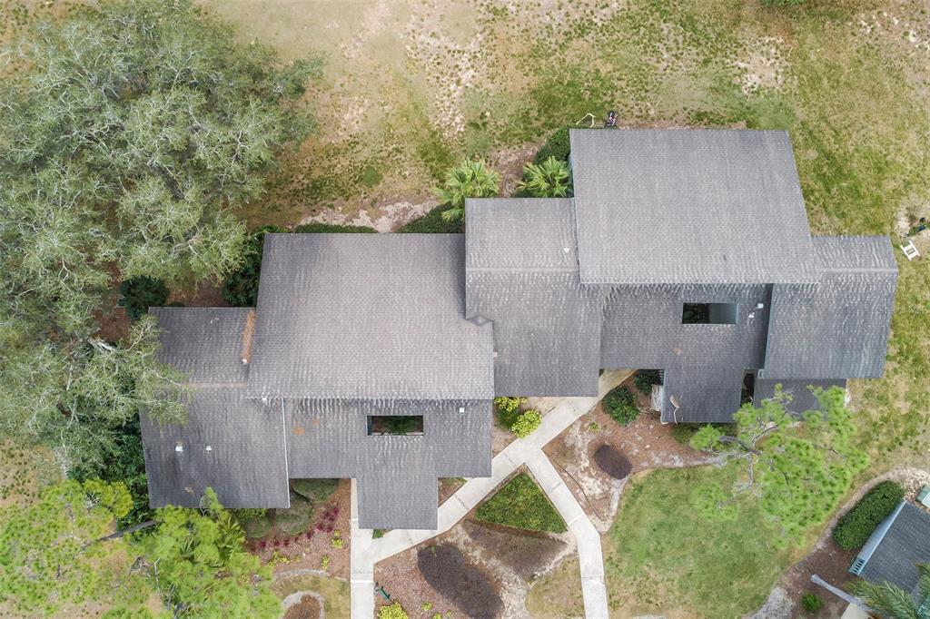 2070 Corner Lake, Unit AB Haines City, FL 33844 - Photo 31 of 31 an aerial view of a house with table and chairs