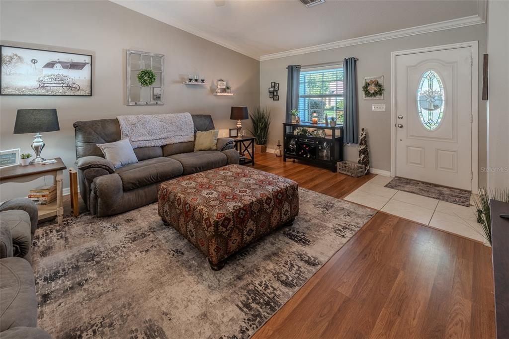 15143 Southwest 14th Avenue Road Ocala, FL 34473 - Photo 6 of 53 a living room with furniture and a window