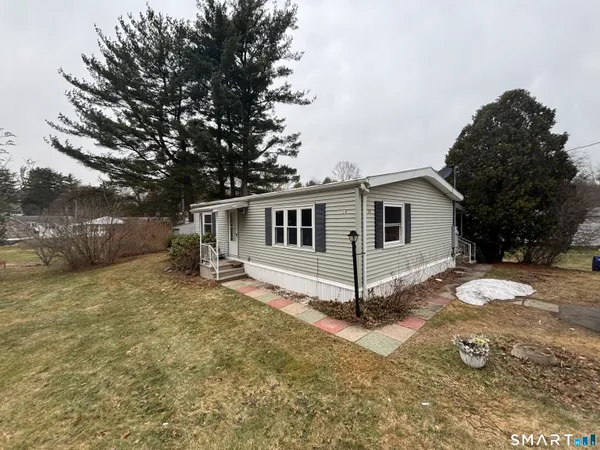 a view of a house with a yard
