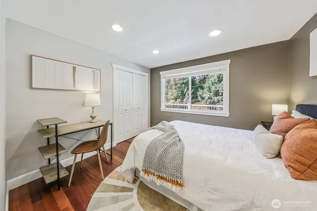 a bedroom with a bed and a window