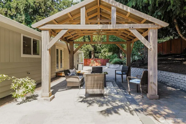 a view of a chairs and table in the patio