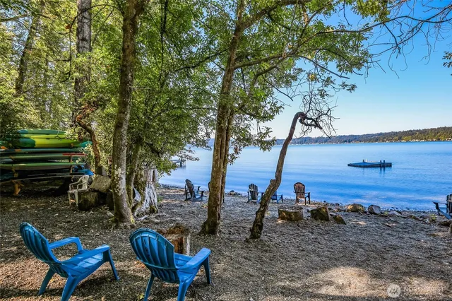 a view of a backyard with chairs