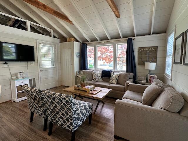 242 Old Wharf Road, Unit F7 Dennis Port, MA 02639 - Photo 11 of 48 a living room with furniture a flat screen tv and a large window