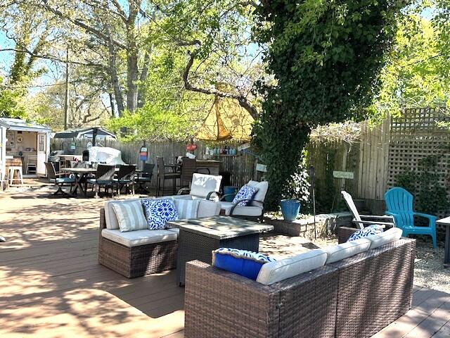 242 Old Wharf Road, Unit F7 Dennis Port, MA 02639 - Photo 37 of 48 a view of a patio with couches and a fire pit