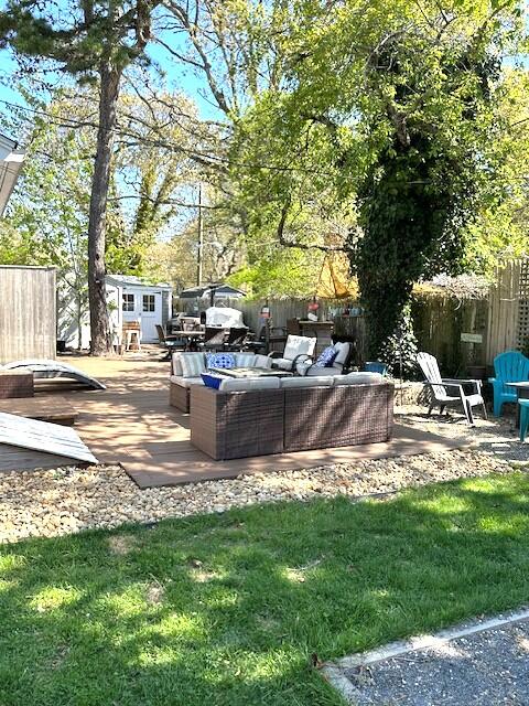 242 Old Wharf Road, Unit F7 Dennis Port, MA 02639 - Photo 44 of 48 a view of a fountain in a yard with palm trees