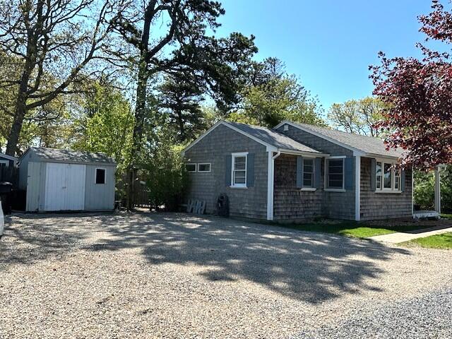 242 Old Wharf Road, Unit F7 Dennis Port, MA 02639 - Photo 5 of 48 a front view of a house with a garden
