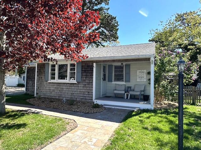 242 Old Wharf Road, Unit F7 Dennis Port, MA 02639 - Photo 10 of 48 a front view of a house with garden