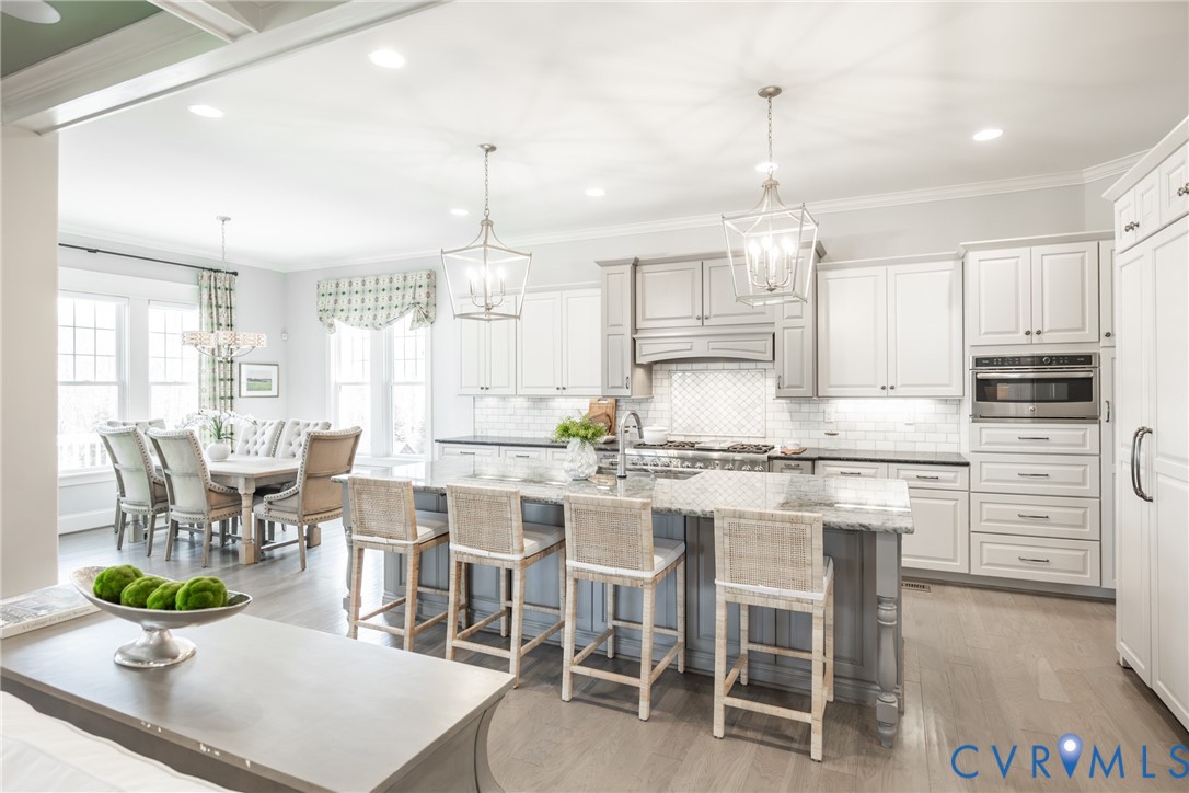 16136 Old Castle Road Midlothian, VA 23112 - Photo 10 of 76 Expansive island with bar ledge and additional sto