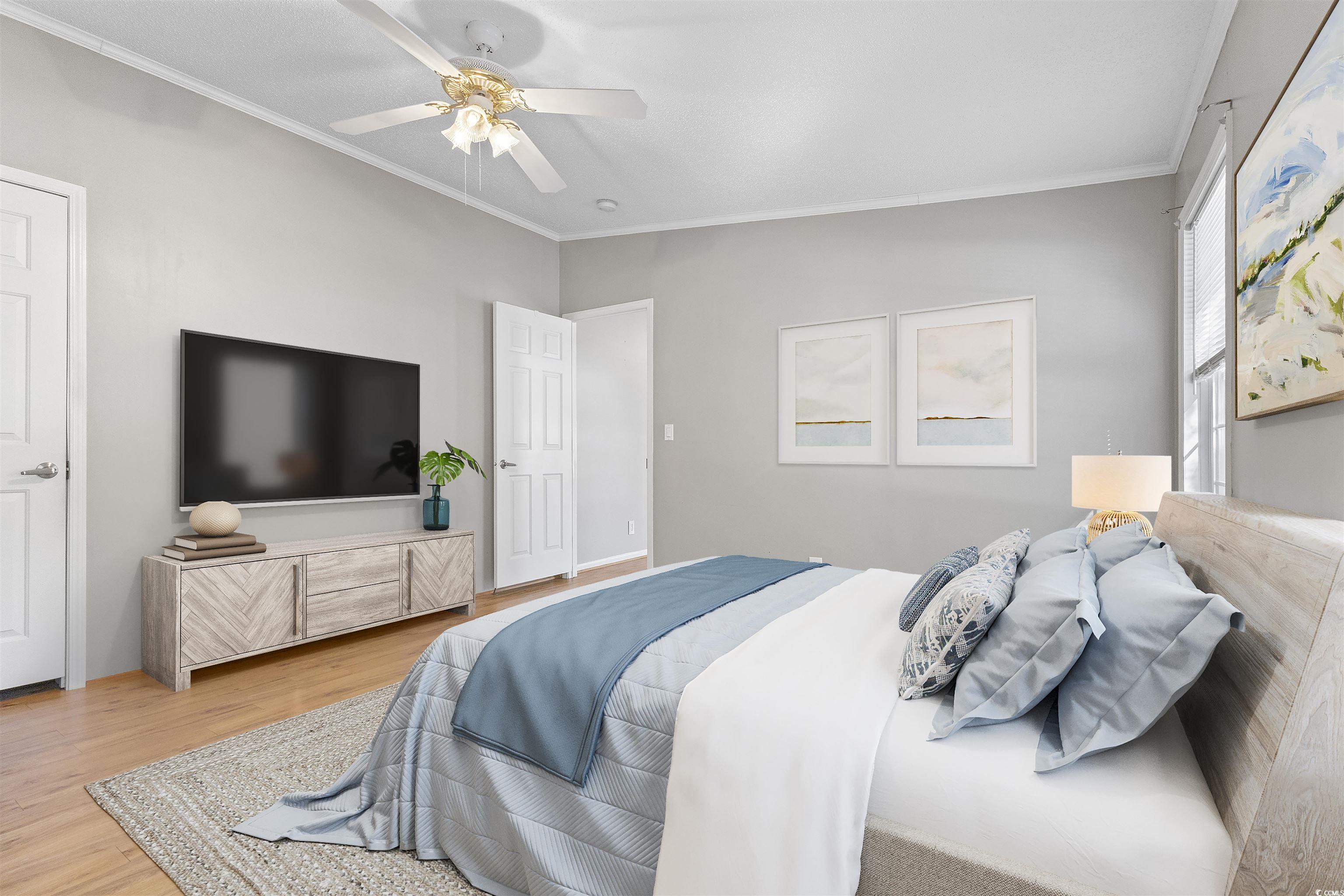 48 Talon Circle Murrells Inlet, SC 29576 - Photo 15 of 28 Bedroom with ornamental molding, ceiling fan, and wood finished floors