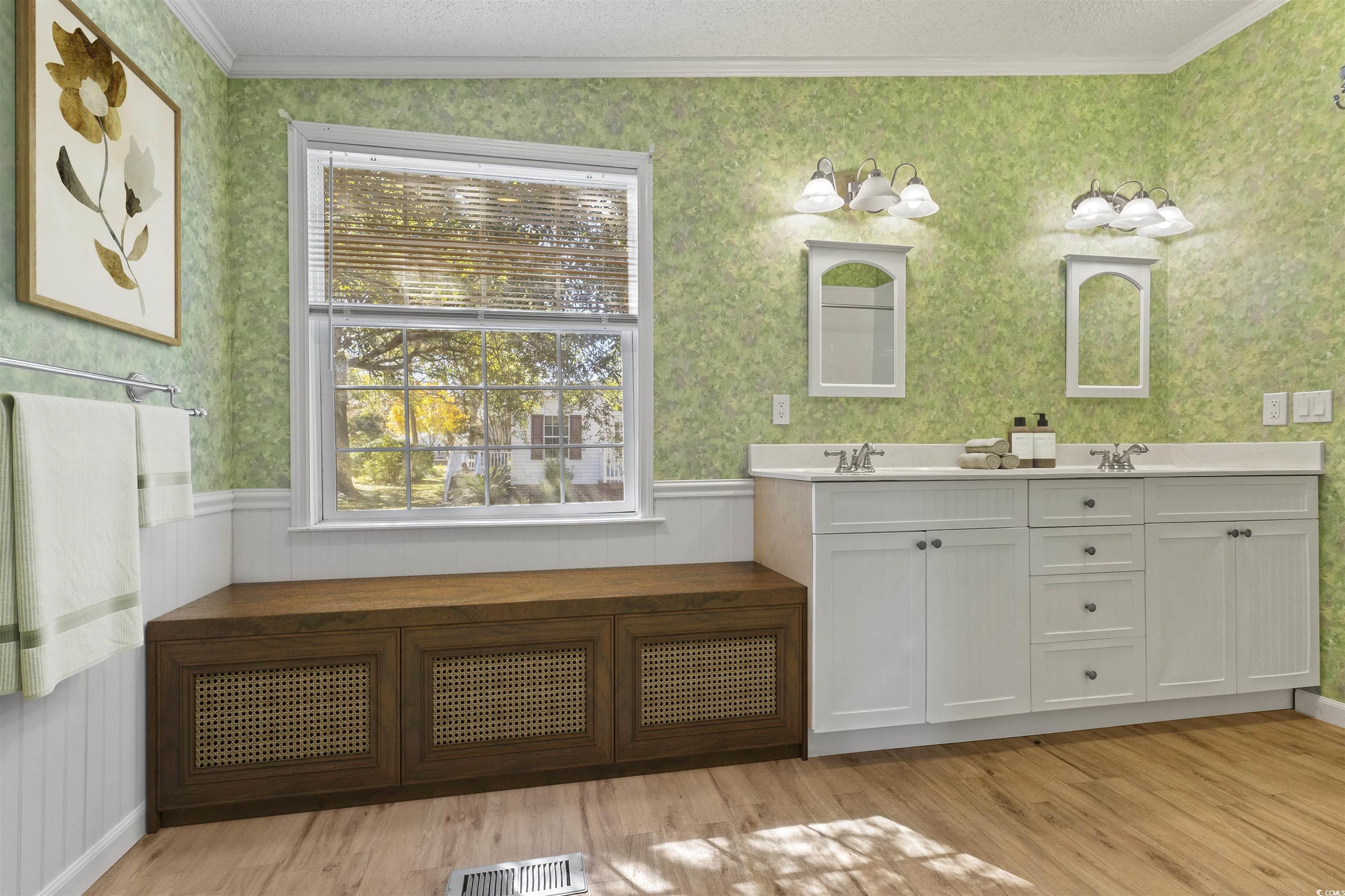 48 Talon Circle Murrells Inlet, SC 29576 - Photo 17 of 28 Full bath with wallpapered walls, ornamental molding, double vanity, a textured ceiling, and light wood-style flooring