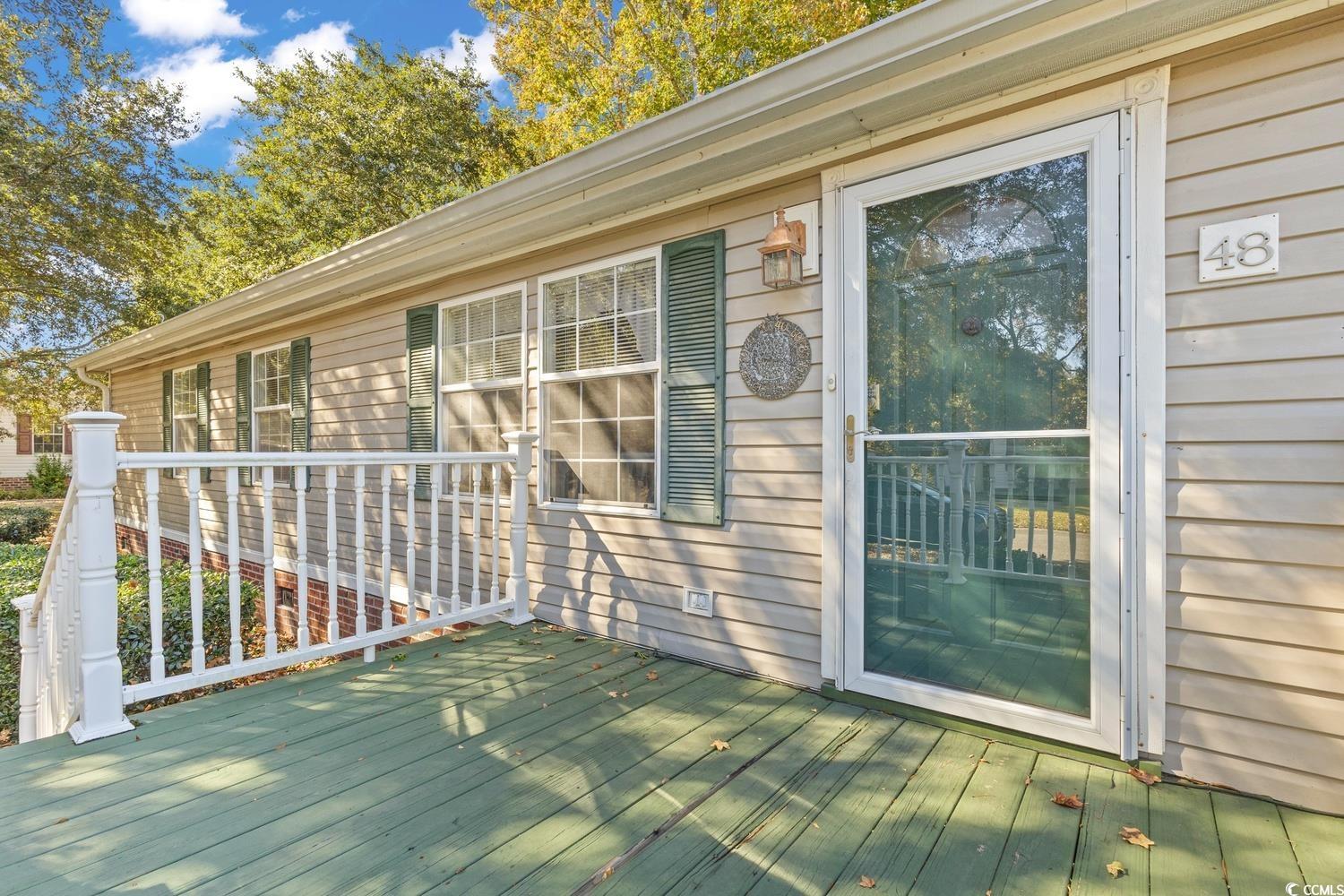 48 Talon Circle Murrells Inlet, SC 29576 - Photo 3 of 28 View of front wooden porch deck