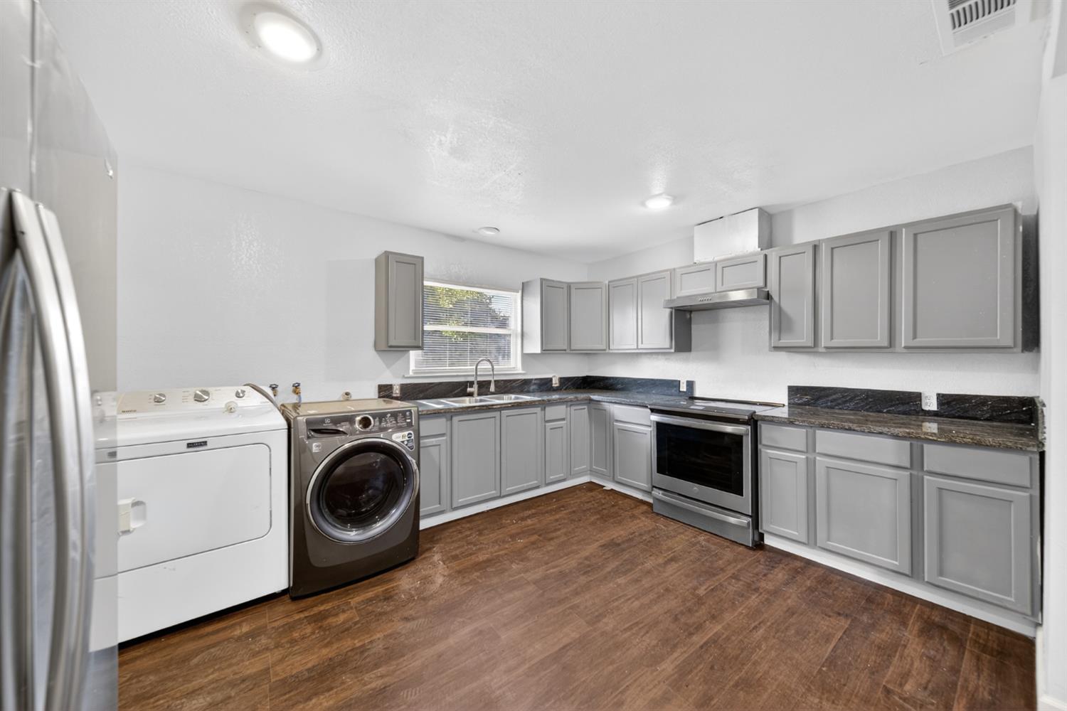 622 South 11th Street Fresno, CA 93702 - Photo 19 of 37 a kitchen with a stove top oven sink and cabinets