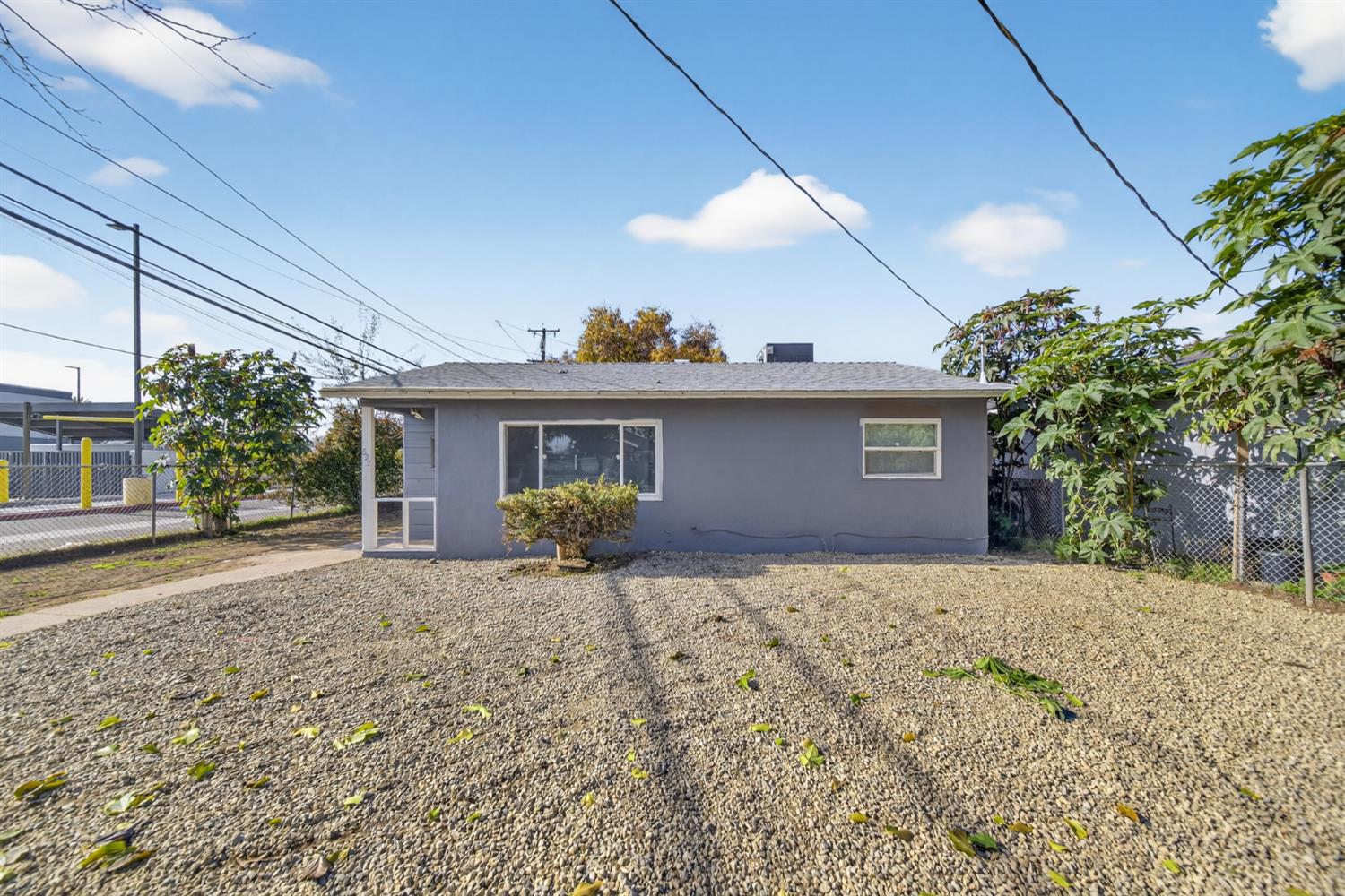 622 South 11th Street Fresno, CA 93702 - Photo 2 of 37 a view of a house with a yard and potted plants