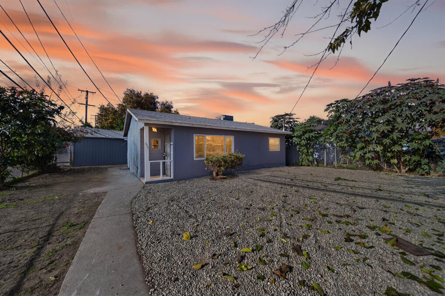 622 South 11th Street Fresno, CA 93702 - Photo 28 of 37 a front view of a house with a yard and garage