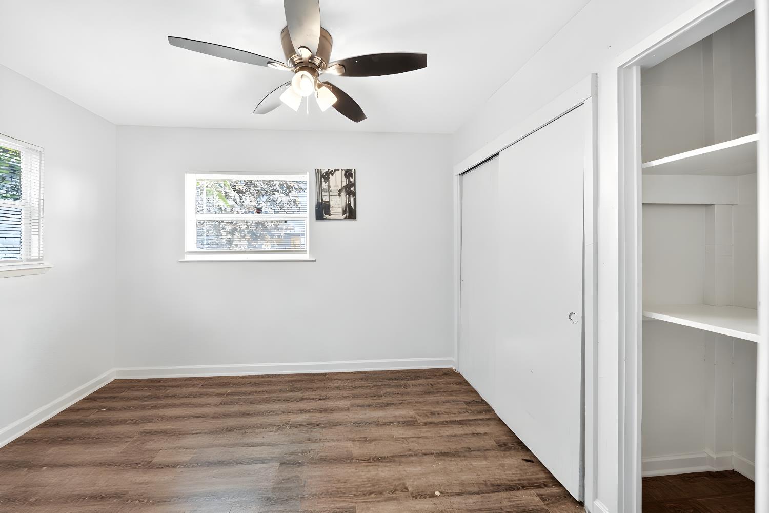 622 South 11th Street Fresno, CA 93702 - Photo 32 of 37 a view of an empty room with wooden floor