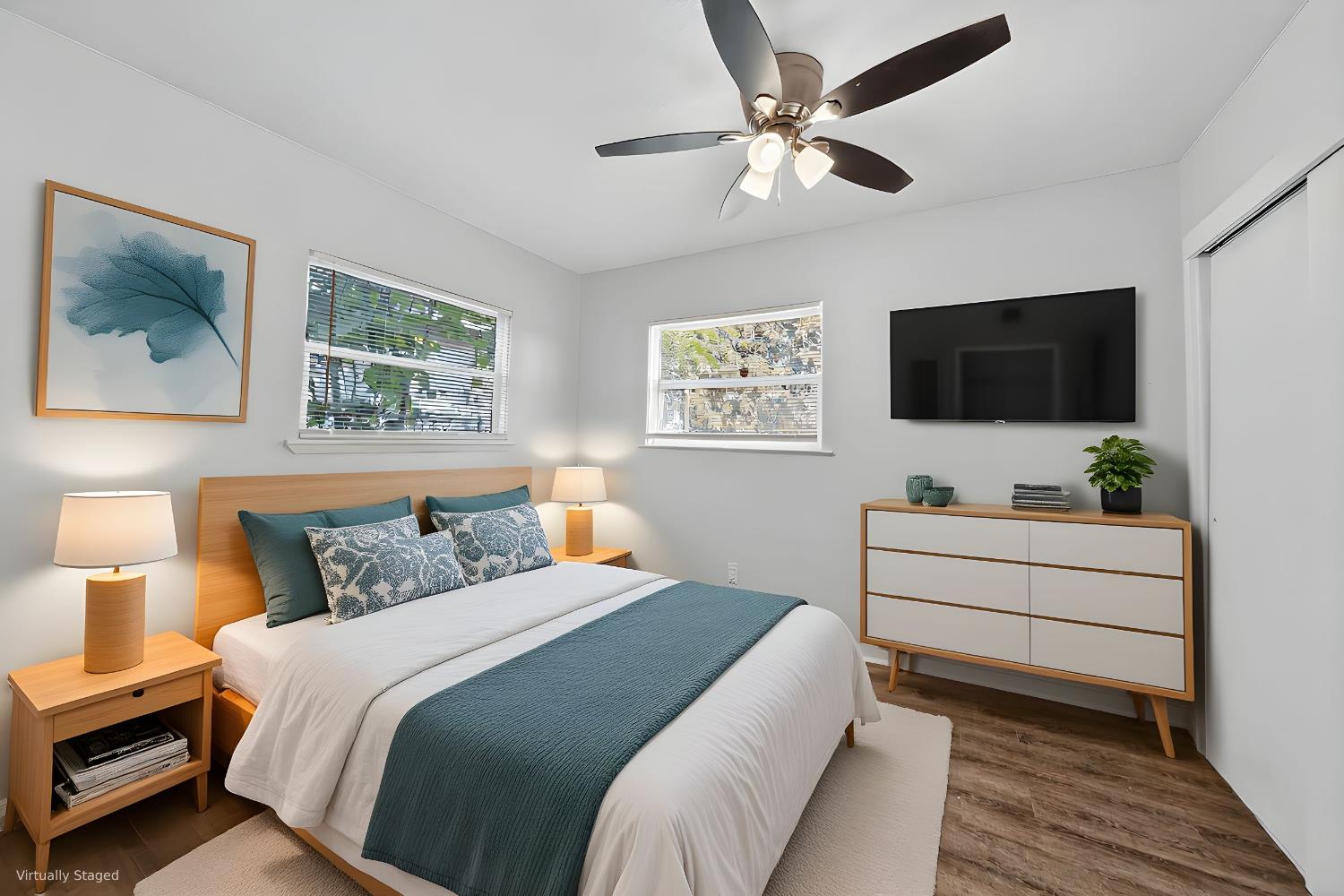 622 South 11th Street Fresno, CA 93702 - Photo 35 of 37 a spacious bedroom with a bed and a flat screen tv