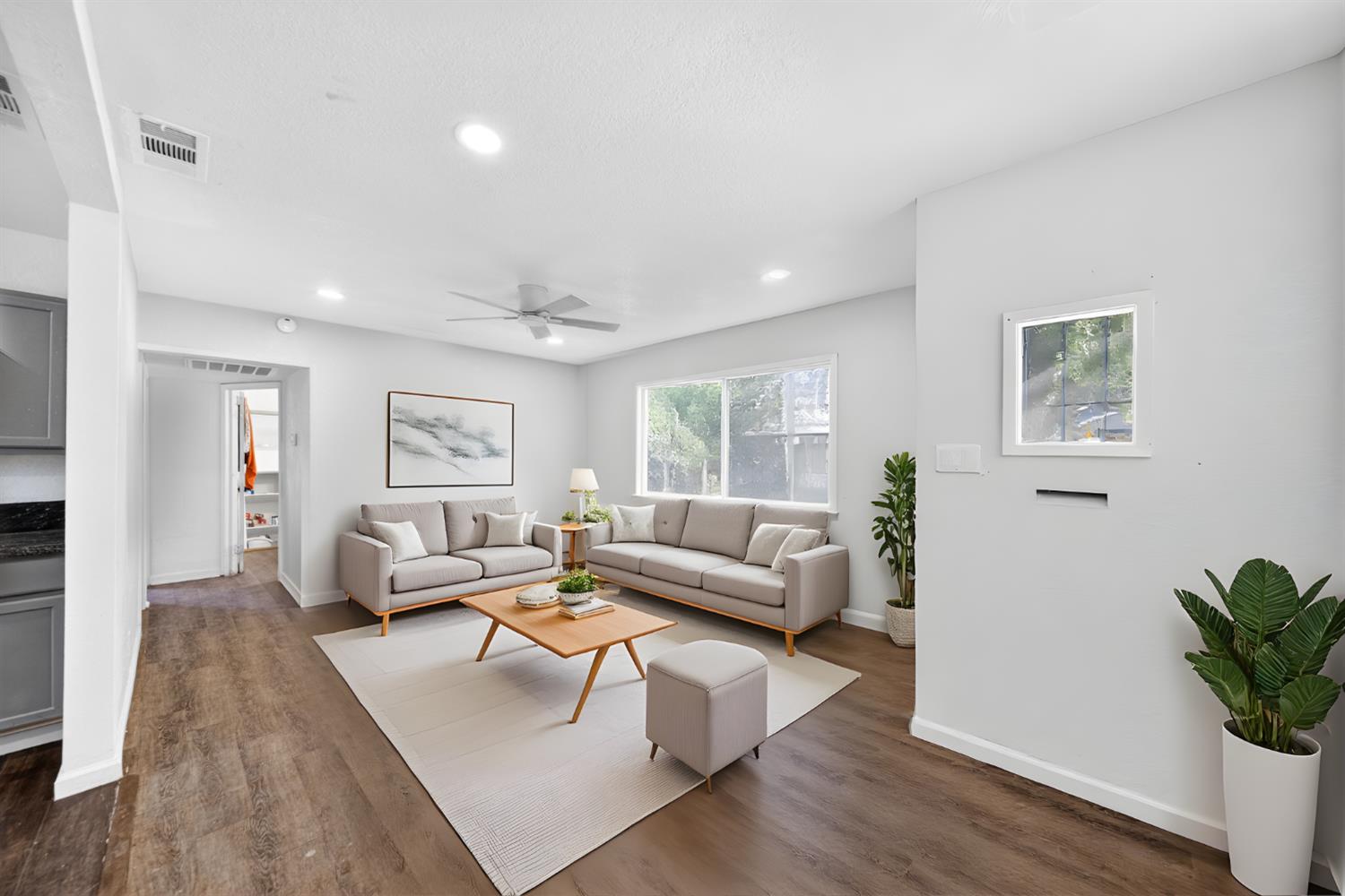 622 South 11th Street Fresno, CA 93702 - Photo 37 of 37 a living room with furniture and a wooden floor