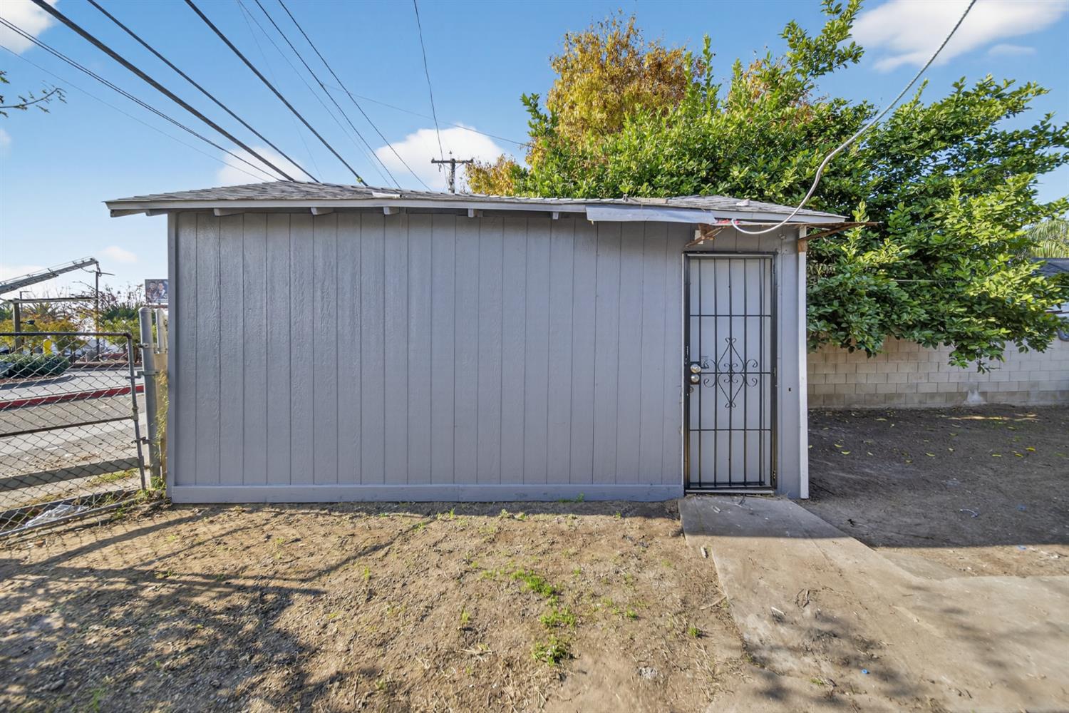 622 South 11th Street Fresno, CA 93702 - Photo 5 of 37 a wooden door in the side of a road
