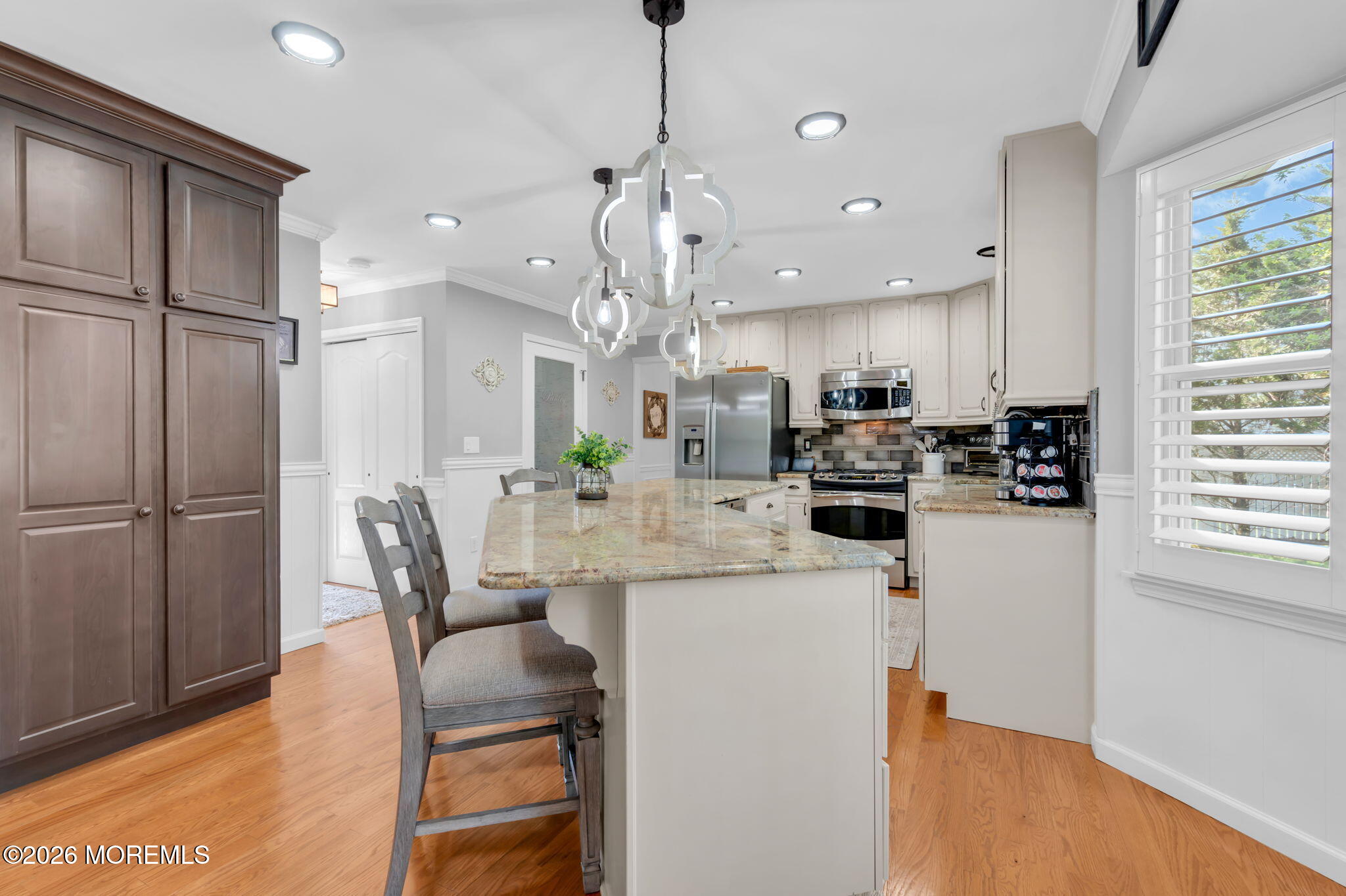 9 Eagle Ridge Lane West Creek, NJ 08092 - Photo 15 of 55 a kitchen with refrigerator and chairs