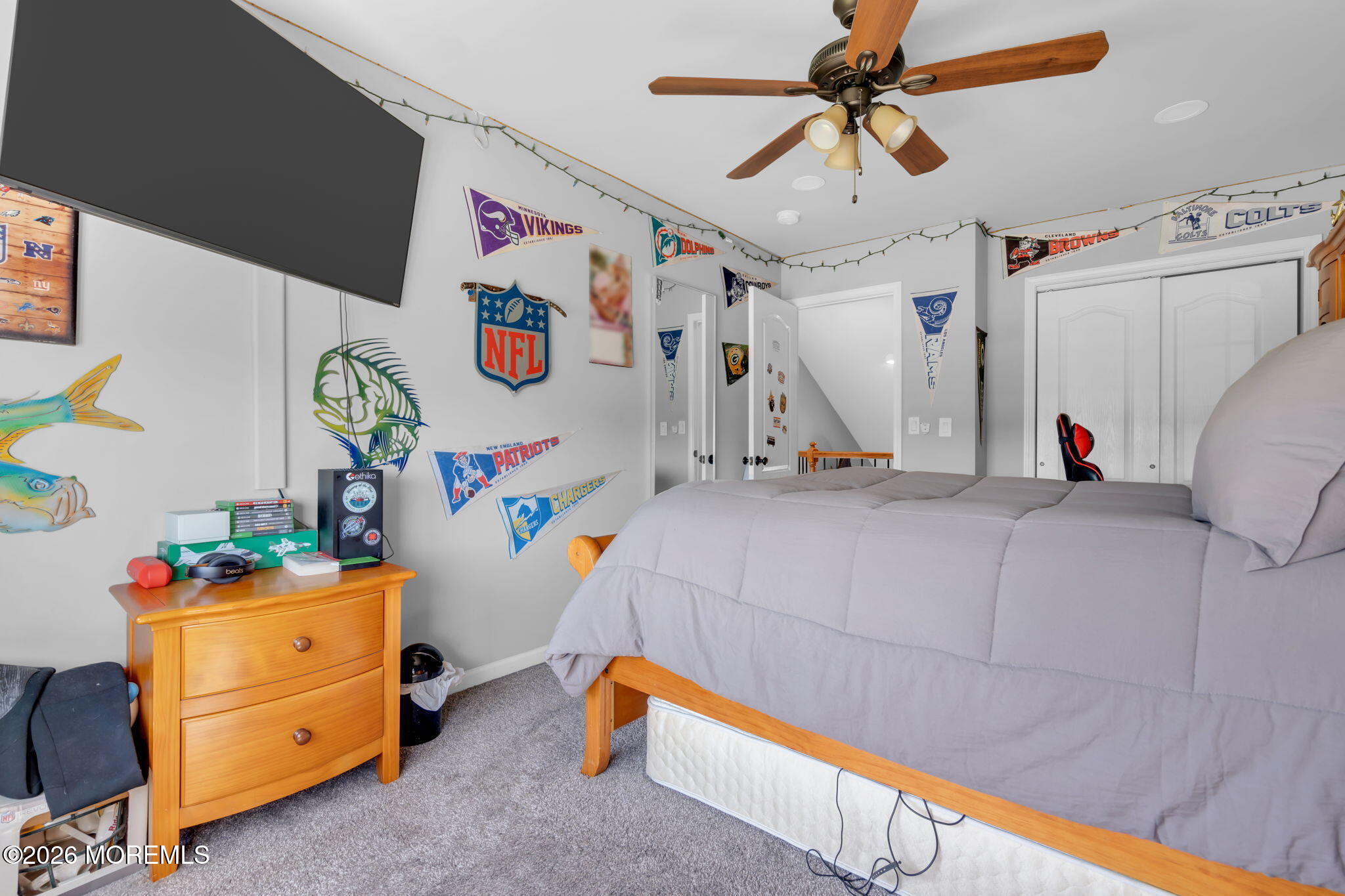 9 Eagle Ridge Lane West Creek, NJ 08092 - Photo 25 of 55 a bedroom with a bed and a chandelier