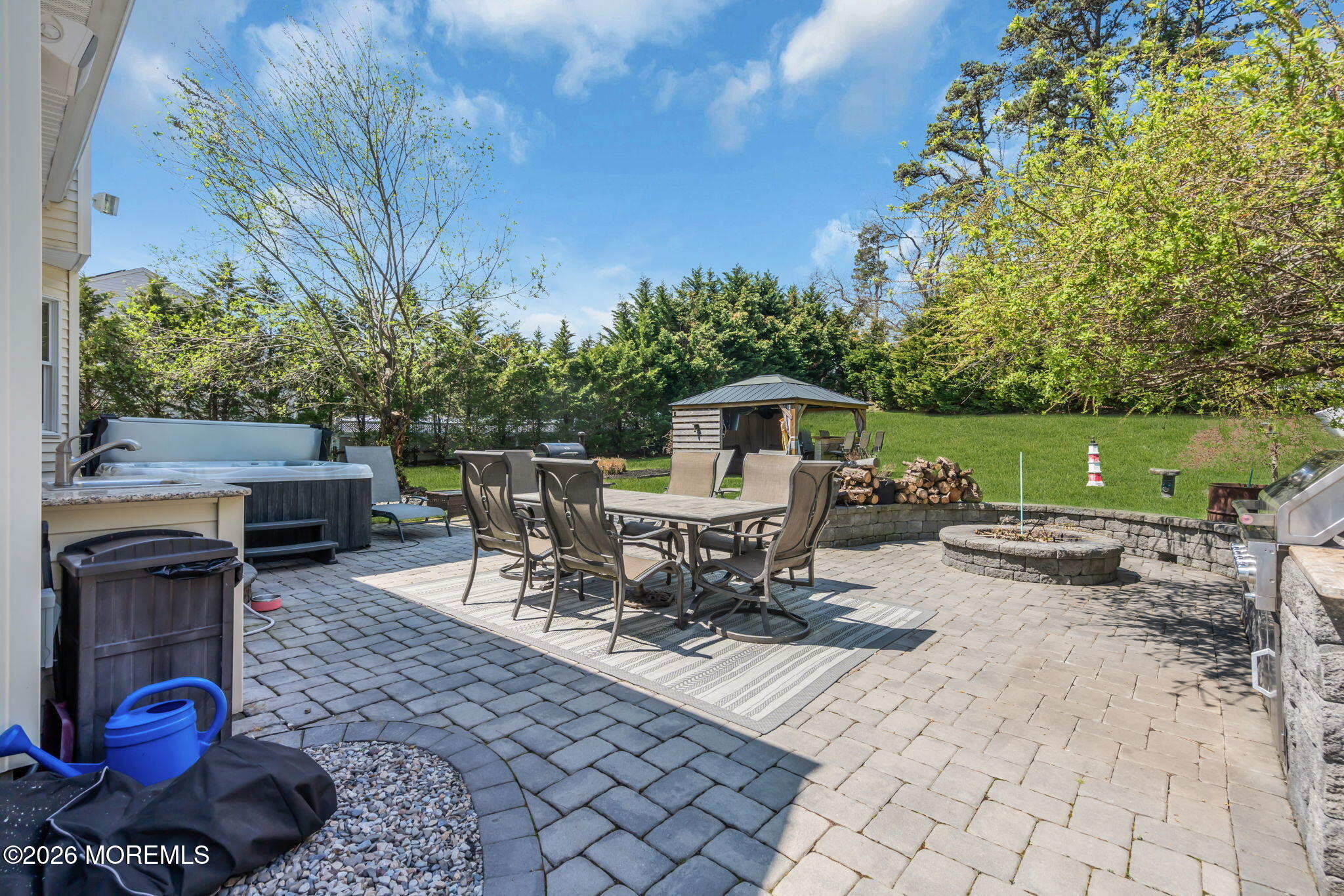 9 Eagle Ridge Lane West Creek, NJ 08092 - Photo 29 of 55 a view of a patio with a dining table and chairs with a fire pit