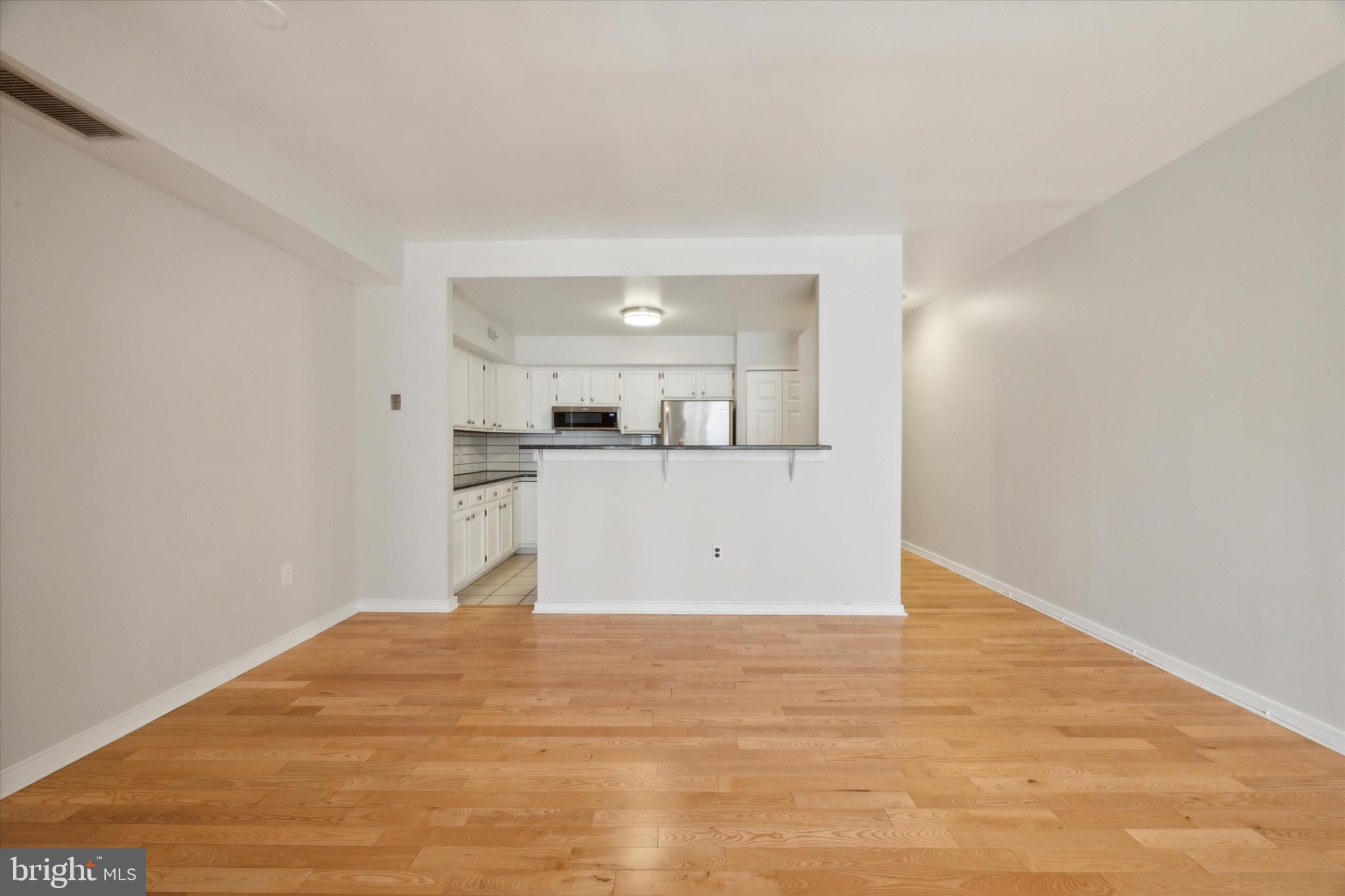 222 Church Street, Unit 3F Philadelphia, PA 19106 - Photo 8 of 19 a view of a kitchen with wooden floor and a sink