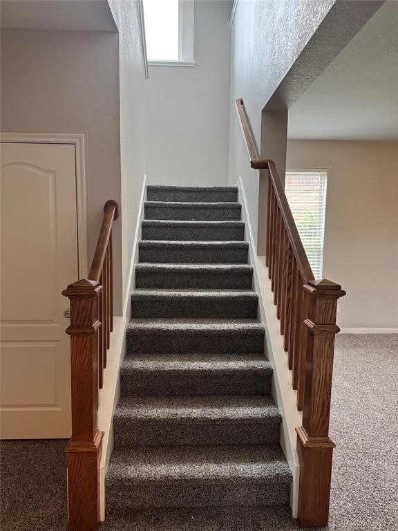 2818 Mezzomonte Lane League City, TX 77573 - Photo 9 of 13 a view of staircase with wooden floor and white walls