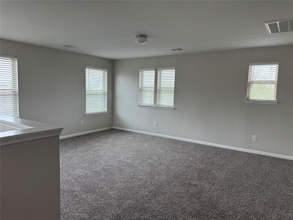 2818 Mezzomonte Lane League City, TX 77573 - Photo 10 of 13 an empty room with windows