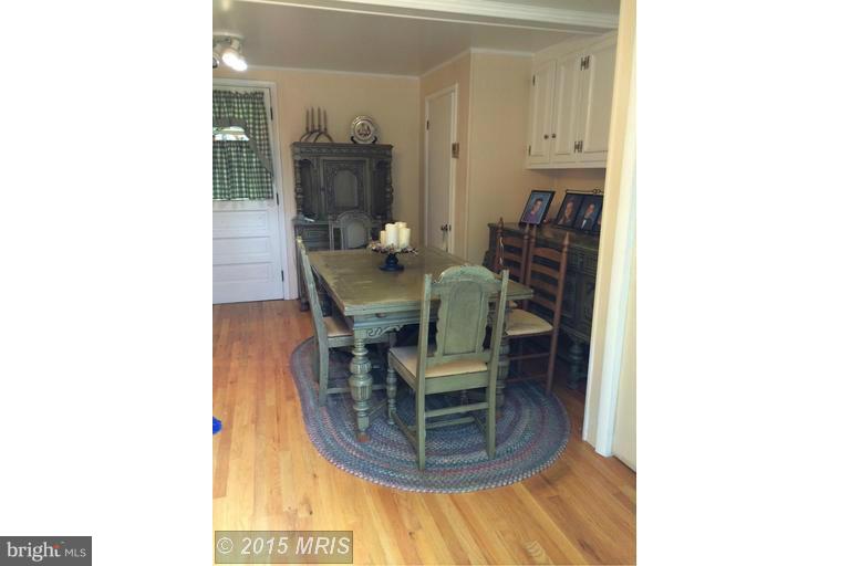 1868 Garrett Road Manchester, MD 21102 - Photo 5 of 20 a view of a dining room with furniture and wooden floor