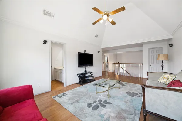 a living room with furniture and a flat screen tv
