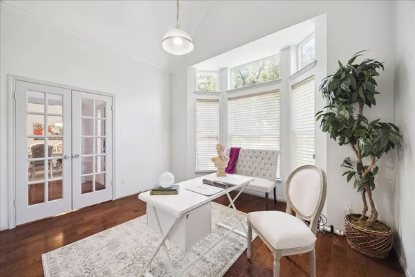 a workspace with furniture window and flowerpot