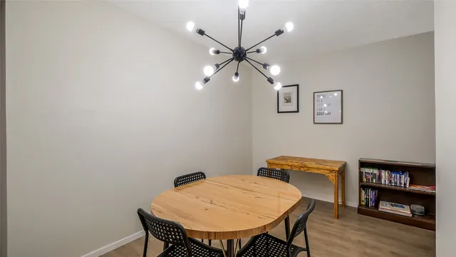 a view of a room with furniture and wooden floor